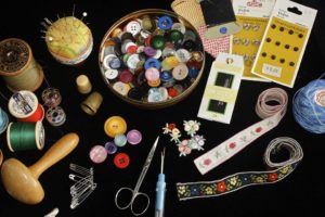 numerous assorted sewing accessories laying